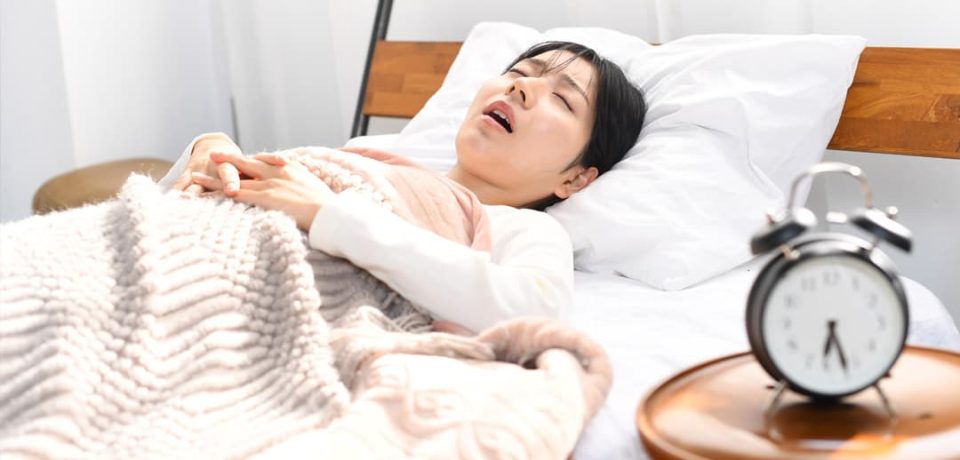 Asian-woman-snoring An image depicting an Asian woman snoring