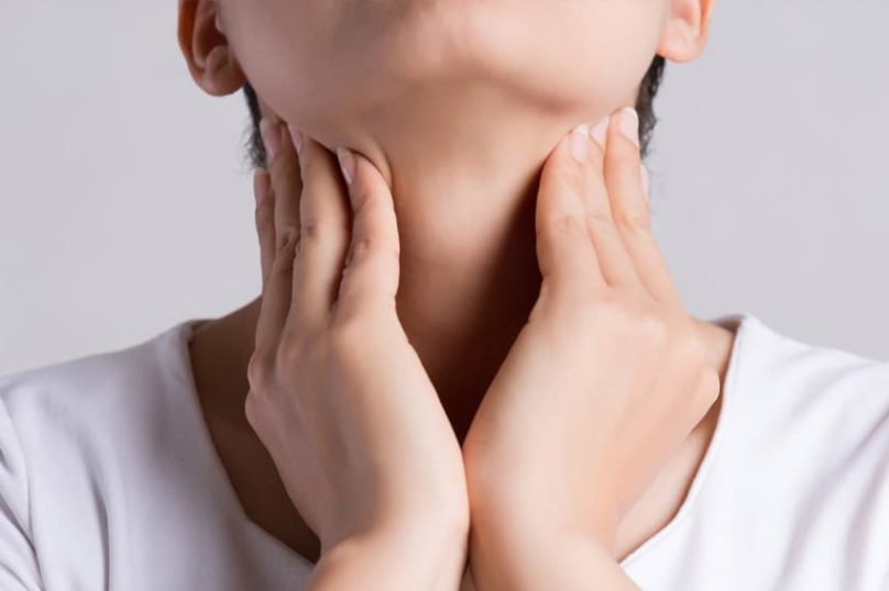 Awareness of a neck lump in the thyroid region