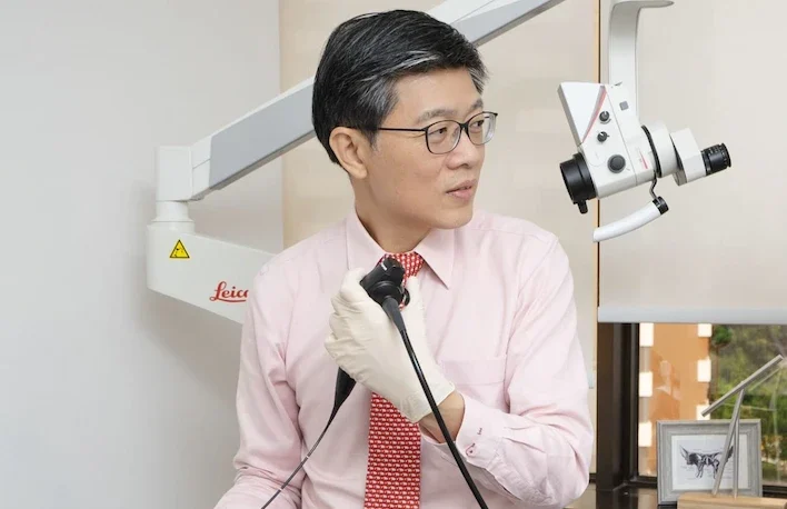Dr Ong Yew Kwang performing a nasal endoscopy on a patient